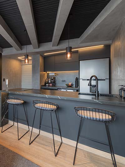 Kitchen and dining area with black marbled counter tops