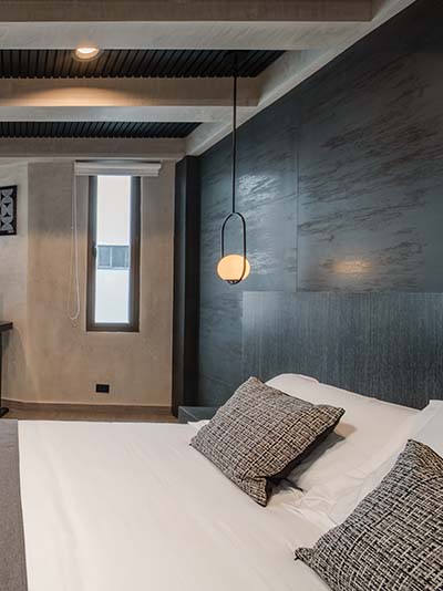 Bedroom with large TV and workstation