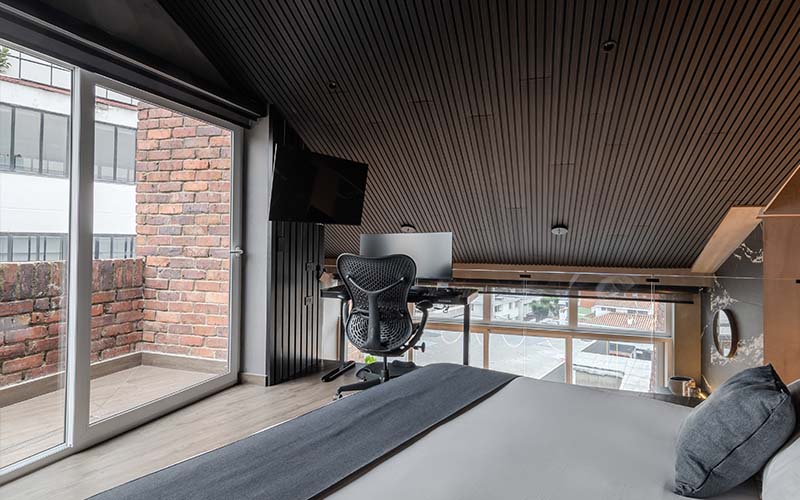 Bedroom also features work station and TV